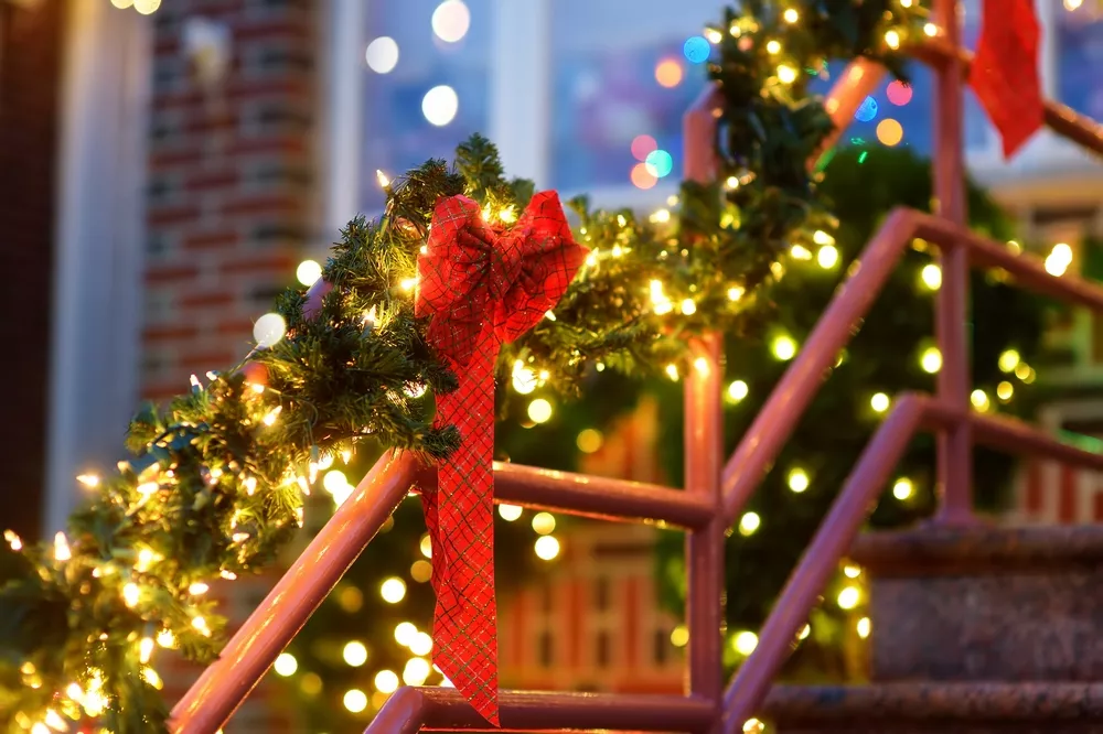 How To Take Your Staircase Christmas Decorating To The Next Level